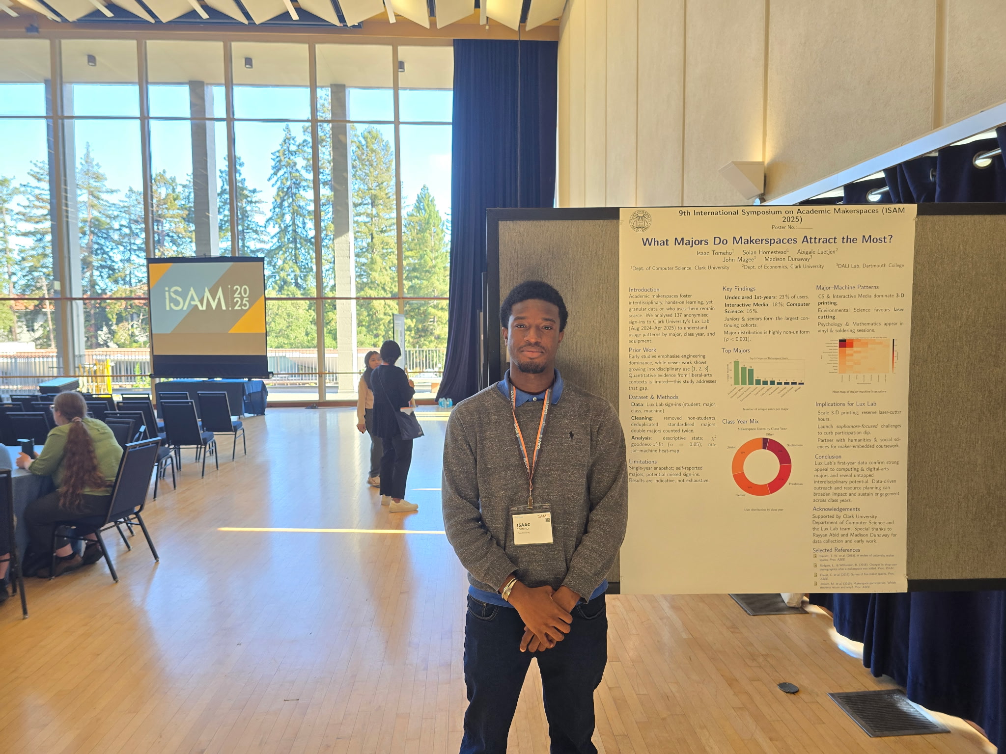 Isaac presenting research poster at ISAM 2025